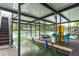 Waterfront dock with covered area, swim platform, and chairs for relaxing by the lake at 6029 Shadburn Ferry Rd, Buford, GA 30518
