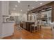 Spacious kitchen island with seating, stainless steel appliances, and open layout at 6029 Shadburn Ferry Rd, Buford, GA 30518