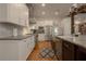 Beautiful kitchen with white cabinets, stainless steel appliances, and modern fixtures at 6029 Shadburn Ferry Rd, Buford, GA 30518