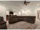 Relaxing living room featuring a large comfortable sofa and view of the bar at 6029 Shadburn Ferry Rd, Buford, GA 30518