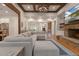 An open-concept floor plan showcases the living room with stone fireplace and kitchen in the background at 6029 Shadburn Ferry Rd, Buford, GA 30518