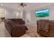 Living room with comfortable seating, a TV, and access to other areas of the house at 6029 Shadburn Ferry Rd, Buford, GA 30518