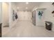 Spacious mudroom with coat racks, storage, and access to laundry room at 6029 Shadburn Ferry Rd, Buford, GA 30518