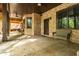 Spacious brick patio featuring a seating area, offering an inviting outdoor space with natural light at 6029 Shadburn Ferry Rd, Buford, GA 30518