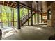 Enjoy serene outdoors on this patio with waterfront views and convenient staircase access to backyard at 6029 Shadburn Ferry Rd, Buford, GA 30518