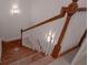 Beautiful wood staircase with white railings, offering a seamless transition between floors and adding architectural detail at 6029 Shadburn Ferry Rd, Buford, GA 30518