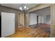 Open living room with hardwood floors and vintage light fixtures, ready for a modern refresh at 1347 Westmont Sw Rd, Atlanta, GA 30311