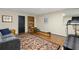 Finished basement with hardwood-look floors, gym equipment, and a sitting area at 238 15Th Ne St # 18, Atlanta, GA 30309