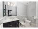 A sleek bathroom offers a contemporary vanity, toilet, bidet and a large mirror at 238 15Th Ne St # 18, Atlanta, GA 30309
