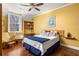 A cozy bedroom featuring hardwood floors, a ceiling fan, and natural light from the window at 238 15Th Ne St # 18, Atlanta, GA 30309
