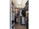 A well-organized walk-in closet featuring ample shelving, hanging space, and plenty of storage at 238 15Th Ne St # 18, Atlanta, GA 30309