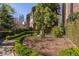 Brick townhome complex with manicured garden spaces at 238 15Th Ne St # 18, Atlanta, GA 30309