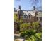 Charming brick home with dormer windows, a tiled roof, and lush green landscaping at 238 15Th Ne St # 18, Atlanta, GA 30309