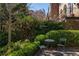 Serene garden space with wrought iron seating next to townhome at 238 15Th Ne St # 18, Atlanta, GA 30309