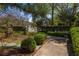 Beautifully landscaped garden with manicured hedges and walkway at 238 15Th Ne St # 18, Atlanta, GA 30309