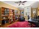 Bright home office featuring a ceiling fan, natural light, built-in bookshelves, and desk space at 238 15Th Ne St # 18, Atlanta, GA 30309