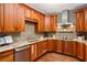 Bright kitchen featuring custom wood cabinetry, stone countertops, tile backsplash, and stainless steel appliances at 238 15Th Ne St # 18, Atlanta, GA 30309