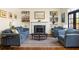 Cozy living room with fireplace, built-in bookshelves, and plush seating at 238 15Th Ne St # 18, Atlanta, GA 30309
