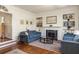Bright living room features fireplace, built-in shelving and hardwood floors at 238 15Th Ne St # 18, Atlanta, GA 30309