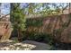 Secluded stone patio features privacy walls, verdant ground cover, and an intimate outdoor setting at 238 15Th Ne St # 18, Atlanta, GA 30309