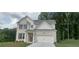 Charming two-story home features a brick facade, attached two car garage, and a manicured front lawn at 6015 Spring Way, Stonecrest, GA 30038