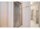 Bathroom showing enclosed shower with patterned wall paper at 950 Sundew Se Dr, Conyers, GA 30013