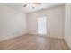 Bedroom featuring updated ceiling fan, wood-look floors and a large window at 950 Sundew Se Dr, Conyers, GA 30013