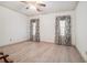 Spacious bedroom with light wood flooring, neutral walls, and decorative window treatments at 950 Sundew Se Dr, Conyers, GA 30013