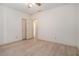 Bedroom featuring updated ceiling fan, wood-look floors and closet space at 950 Sundew Se Dr, Conyers, GA 30013