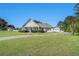 Spacious home features a well-manicured lawn, circular drive, and mature trees at 950 Sundew Se Dr, Conyers, GA 30013