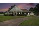 Charming one-story home boasts mature landscaping and a welcoming front porch at 950 Sundew Se Dr, Conyers, GA 30013
