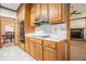 Well-equipped kitchen with wood cabinetry, tile floors, and modern appliances at 950 Sundew Se Dr, Conyers, GA 30013