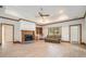 Bright living room with wood floors, fireplace, built-in shelving, and natural light at 950 Sundew Se Dr, Conyers, GA 30013