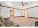 Cozy living room features wood floors, fireplace, and access to kitchen and bedrooms at 950 Sundew Se Dr, Conyers, GA 30013