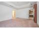 Main bedroom with decorative tray ceiling and view to kitchen at 950 Sundew Se Dr, Conyers, GA 30013