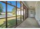 Covered porch showcasing screened walls and a view of the backyard at 950 Sundew Se Dr, Conyers, GA 30013