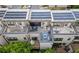 Aerial view showcases townhomes with rooftop amenities including seating, hot tub and outdoor kitchen at 1049 Brandsford Nw St # 27-01, Atlanta, GA 30318