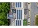 Aerial view of townhome roofs with solar panels and rooftop decks with seating areas at 1049 Brandsford Nw St # 27-01, Atlanta, GA 30318