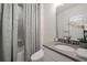 Elegant bathroom featuring a modern shower with a gray tiled surround and stylish sink at 1049 Brandsford Nw St # 27-01, Atlanta, GA 30318