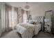 Bright bedroom with tufted headboard, soft carpet, and neutral decor at 1049 Brandsford Nw St # 27-01, Atlanta, GA 30318