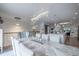 Open-concept dining area featuring a modern chandelier and seamless connection to the kitchen at 1049 Brandsford Nw St # 27-01, Atlanta, GA 30318