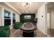 Open game room with a poker table, arcade games, modern lighting, and a feature wall at 1049 Brandsford Nw St # 27-01, Atlanta, GA 30318