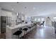 Open-concept kitchen with large island, stainless steel appliances, and seamless flow to dining area at 1049 Brandsford Nw St # 27-01, Atlanta, GA 30318