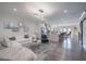 Spacious living room boasts hardwood floors, an open-concept design, and seamless flow to the kitchen at 1049 Brandsford Nw St # 27-01, Atlanta, GA 30318