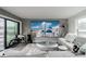 Stylish living room featuring modern décor, a large entertainment center, and comfortable seating at 1049 Brandsford Nw St # 27-01, Atlanta, GA 30318