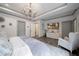 Spacious main bedroom with modern lighting, neutral decor, hardwood floors, and a TV at 1049 Brandsford Nw St # 27-01, Atlanta, GA 30318