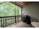 Cozy screened patio with grill, table and chairs, perfect for enjoying the outdoors at 1049 Brandsford Nw St # 27-01, Atlanta, GA 30318