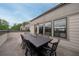Inviting rooftop deck featuring a dark table and chair set for outdoor entertaining with neighborhood views at 1049 Brandsford Nw St # 27-01, Atlanta, GA 30318