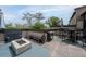 Outdoor rooftop deck with stylish furniture, a fire pit, water feature, and beautiful views at 1049 Brandsford Nw St # 27-01, Atlanta, GA 30318