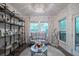 Bright sitting room featuring stylish furniture, a unique chandelier, and ample natural light at 1049 Brandsford Nw St # 27-01, Atlanta, GA 30318